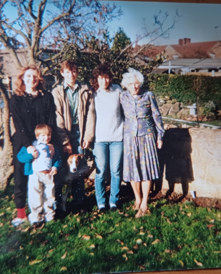 Three generations of a family together in the garden
