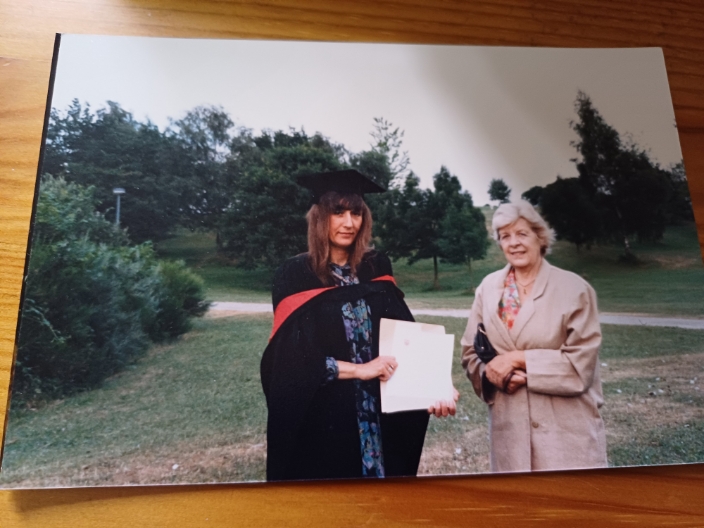 A graduate with her mother on graduation day